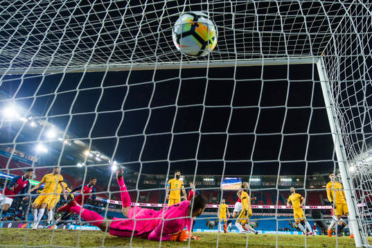 Tore Reginiussen of Norway  scores the 2-1 goal behind