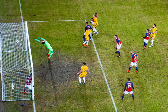 Jackson Irvine of Australia scores 0-1 behind goalkeeper