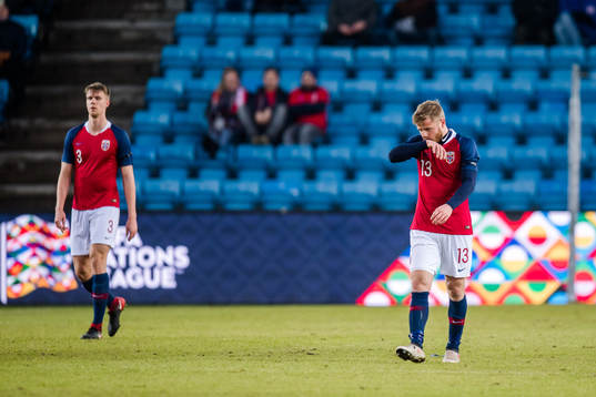 Kristoffer Ajer and Fredrik Midtsjø of Norway looks
