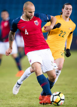 Tore Reginiussen of Norway and Jackson Irvine of Australia