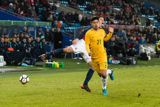 Massimo Luongo of Australia and Markus Henriksen of Norway
