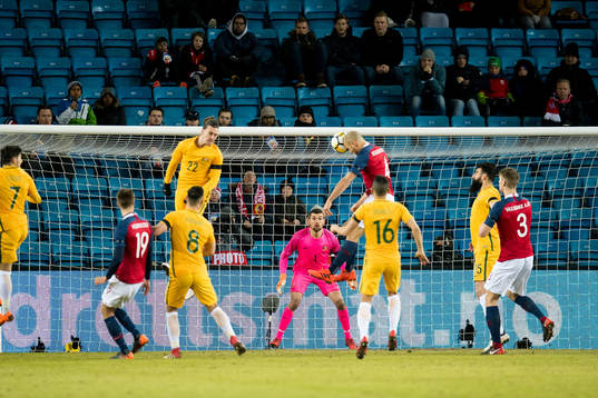 Tore Reginiussen of Norway scores 2-1