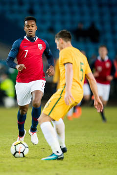 Ola Kamara of Norway and Mark Milligan of Australia