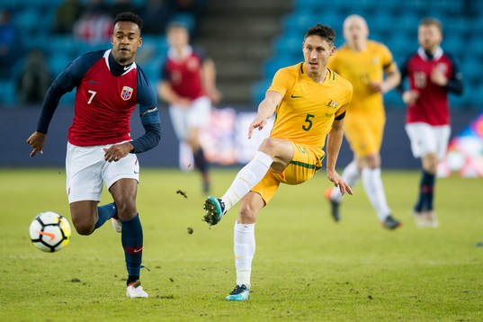 Ola Kamara of Norway and Mark Milligan of Australia
