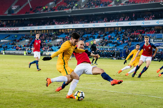 Mattew Leckie of Australia and Tore Reginiussen of Norway