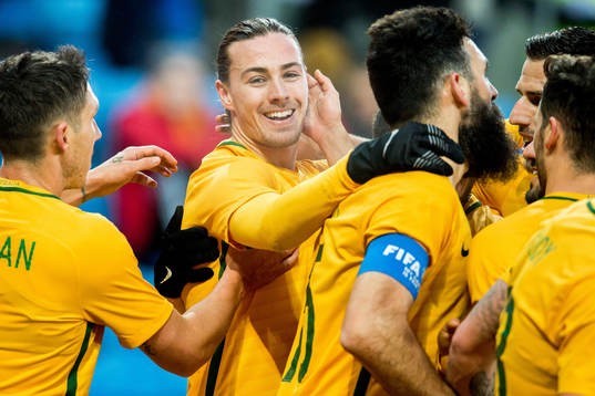 Jackson Irvine of Australia celebrates with teammates