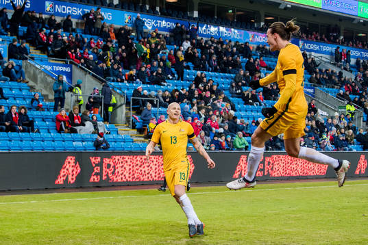 Jackson Irvine of Australia celebrates with teammate Aaron