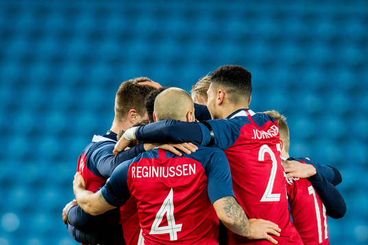 Players of Norway celebrate scoring 3-1