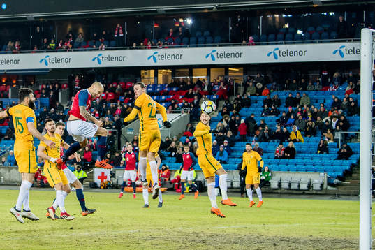Tore Reginiussen of Norway scores 2-1