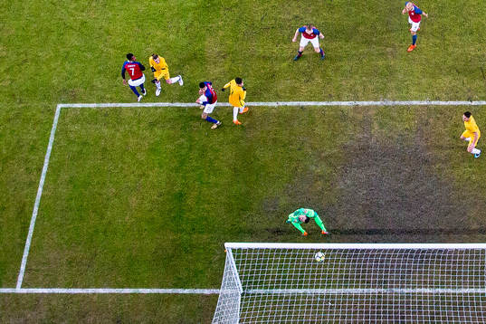 Jackson Irvine of Australia scores 0-1 behind goalkeeper