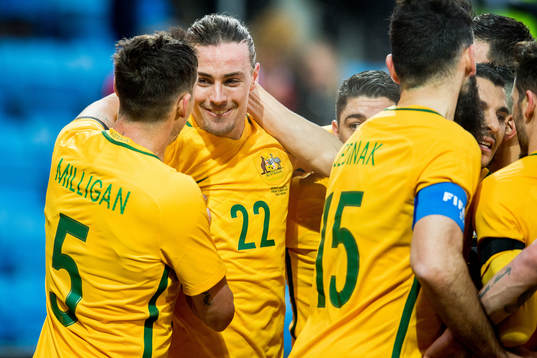 Jackson Irvine of Australia celebrates with teammate Mark