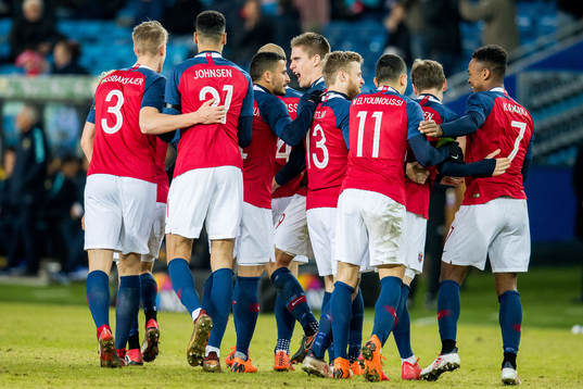 Players of Norway celebrate scoring 2-1