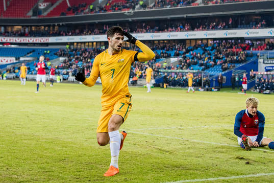 Mattew Leckie of Australia looks dejected