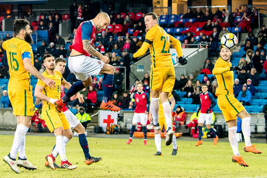Tore Reginiussen of Norway scores 2-1