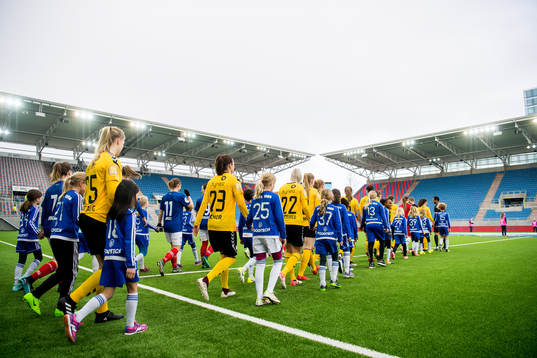 The players enter the field