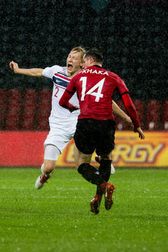 Birger Meling of Norway and Taulant Xhaka of Albania