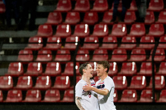 Stefan Johansen and Sigurd Rosted of Norway celebrate 1-0