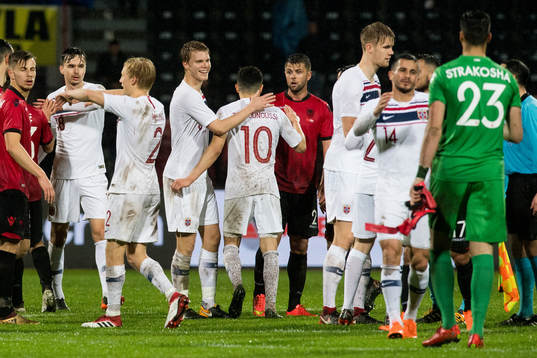 Sigurd Rosted of Norway celebrates with his teammates