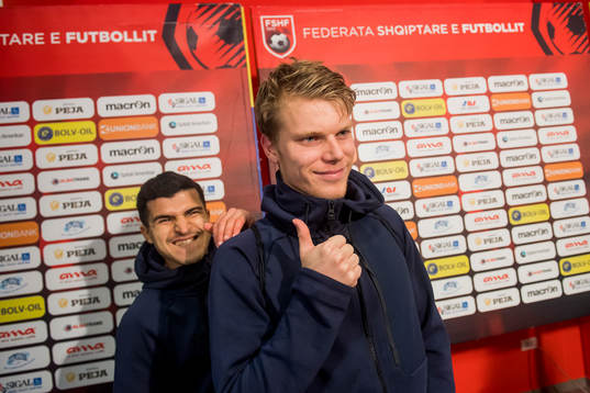 Tarik Elyounoussi and Sigurd Rosted of Norway celebrate in