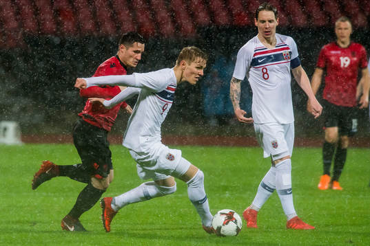 Taulant Xhaka of Albania and Martin Ødegaard of Norway