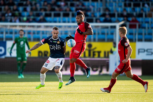 Marcus Pedersen of Strømsgodset and Bismar Acosta of Brann