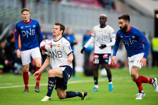 Henning Hauger of Strømsgodset and Magnus Lekven of