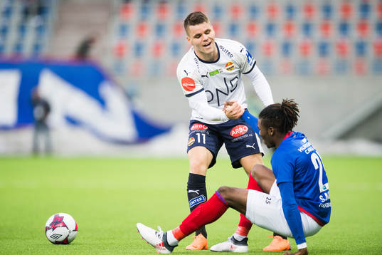 Kristoffer Tokstad of Strømsgodset and Samuel Adekugbe of