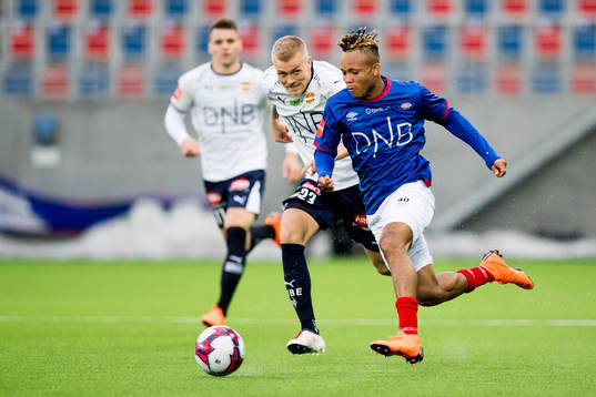 Eirik Ulland Andersen of Strømsgodset and Chidera Ejuke of