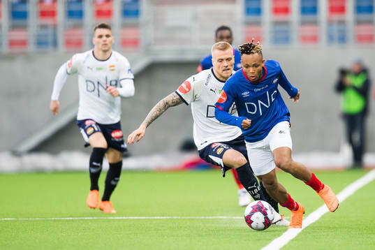 Eirik Ulland Andersen of Strømsgodset and Chidera Ejuke of