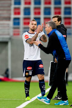 Marcus Pedersen of Strømsgodset and Tor Ole Skullerud,