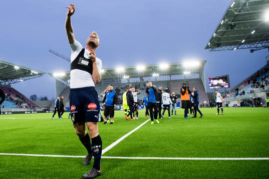 Herman Sørby Stengel of Strømsgodset throws his shirt to