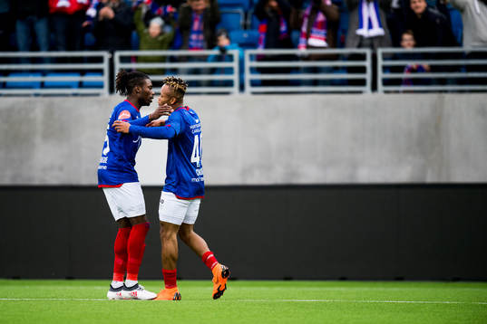 Samuel Adekugbe and Chidera Ejuke of Vålerenga celebrate