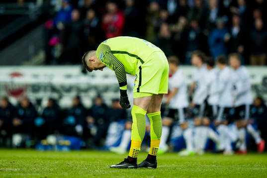 Goalkeeper Andreas Linde of Molde looks dejected