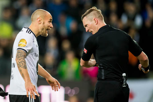 Tore Reginiussen of Rosenborg talks to referee Kai Erik