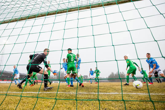Tapio Heikkila of Sandnes Ulf scores 1-1 behind goalkeeper