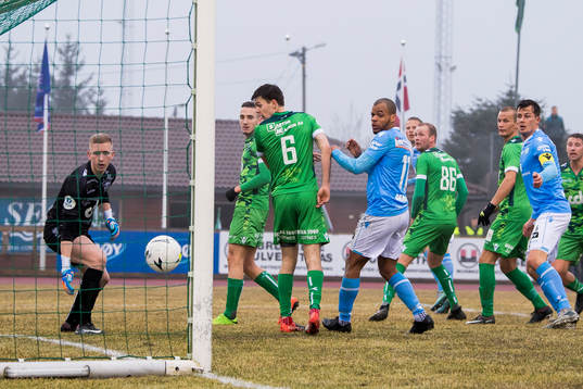Tapio Heikkila of Sandnes Ulf scores 1-1 behind goalkeeper