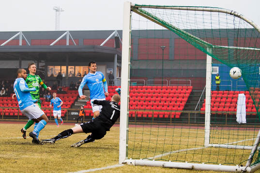 Erixon Danso of Sandnes Ulf scores 1-2 behind goalkeeper