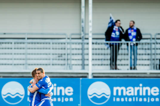 Mohamed Ofkir of Sandefjord celebrates with teammate
