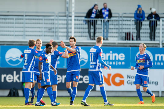Mohamed Ofkir of Sandefjord celebrates with teammates