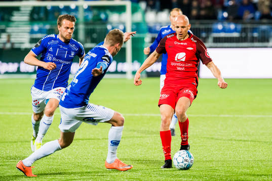 Jon-Helge Tveita  of Sarpsborg 08 and Ruben Kristiansen of