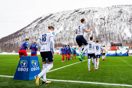 Markus Nakkim of Viking and his teammates enter the pitch