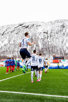 Markus Nakkim of Viking and his teammates enter the pitch