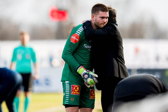 Goalkeeper Gudmund Kongshavn of Tromsø gets a hug from