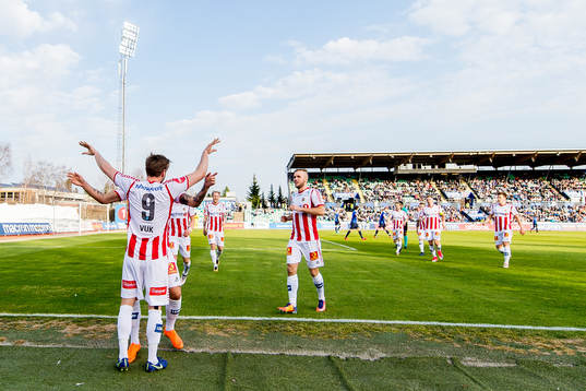 Slobodan Vuk of Tromsø celebrates with teammates Runar