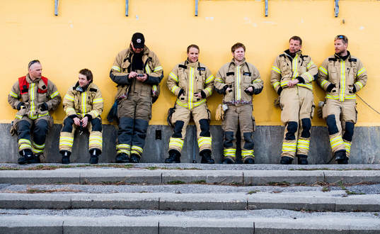 Firemen are watching the Eliteserien match between