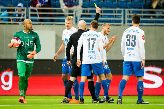 Eirik Hestad of Molde is given a yellow card by Dag Vidar