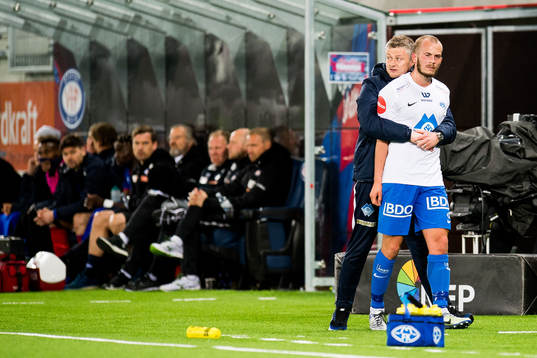 Ole Gunnar Solskjær, manager of Molde, holds Eirik Hestad