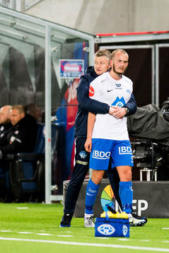 Ole Gunnar Solskjær, manager of Molde, holds Eirik Hestad