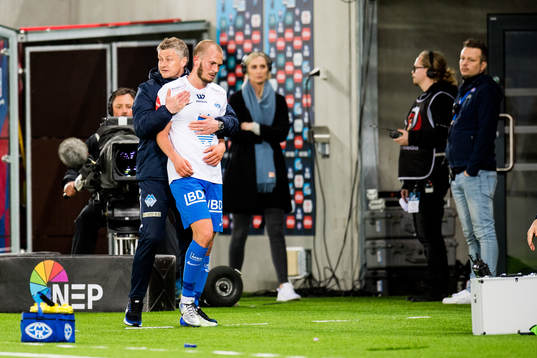 Ole Gunnar Solskjær, manager of Molde, holds Eirik Hestad