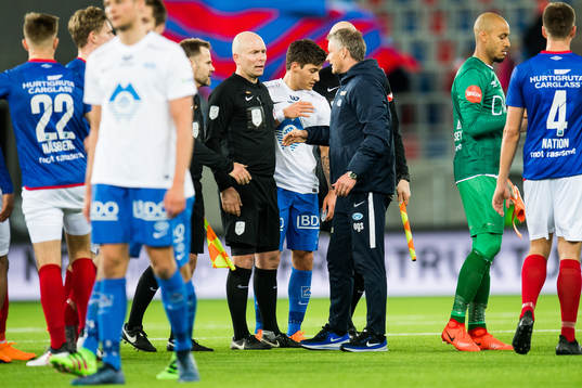 Dag Vidar Hafsås, referee, and Ole Gunnar Solskjær,